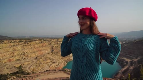 Woman Posing in Knitwear by a Rocky Quarry