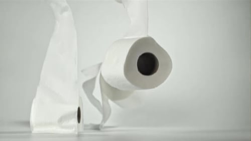 Toilet Paper Falling on the Table on a White Background Filmed on a Highspeed Camera at 1000 Fps