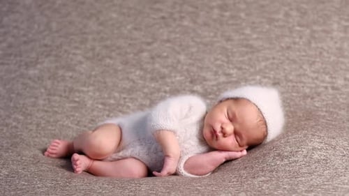 Peaceful Infant Sleeping Soundly on Brown Blanket