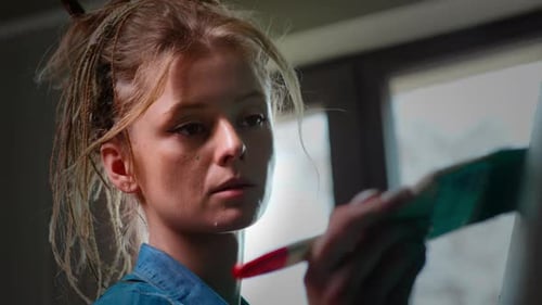 Woman Painting Art on Canvas Close Up