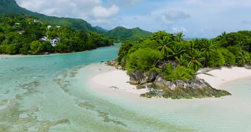 Idyllic White Sandy Beach with Lush Greenery and Turquoise Waters Seychelles Mahe