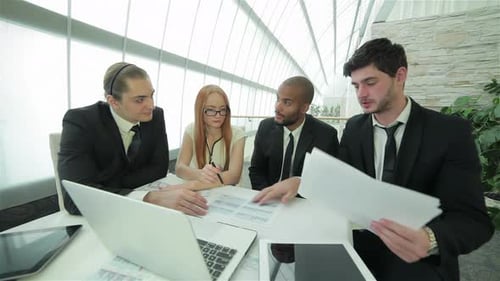Business Team Collaborating on Strategy in Modern Office