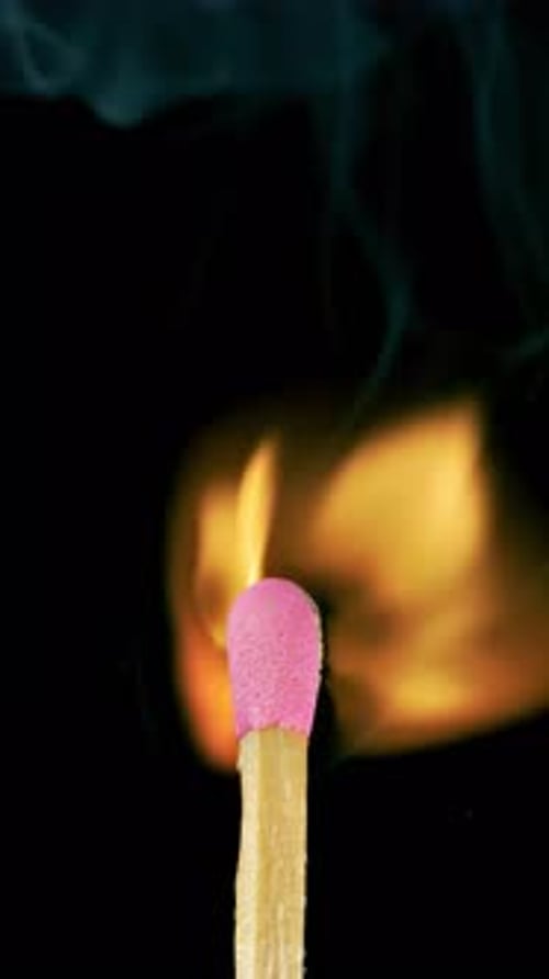 Match Ignites with Fiery Flame and Smoke