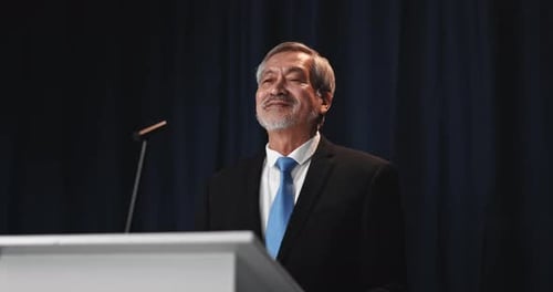Man Giving a Speech at a Podium