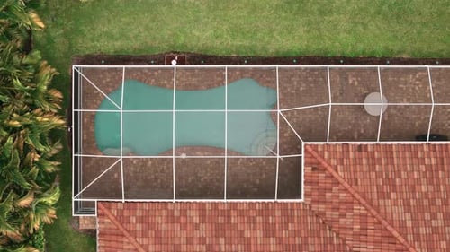 Aerial Above View of Screened in Pool and Lanai in Florida House Top Down Shot