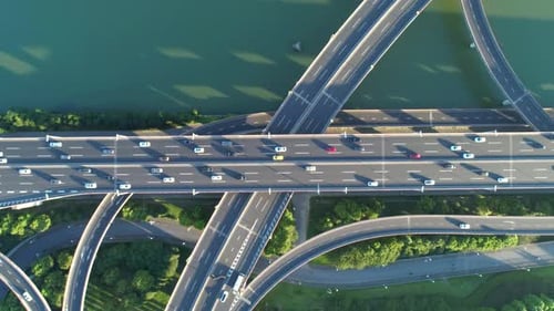 Aerial Drone View of Highway Multilevel Junction Road with Moving Cars at Sunset Active Movement of