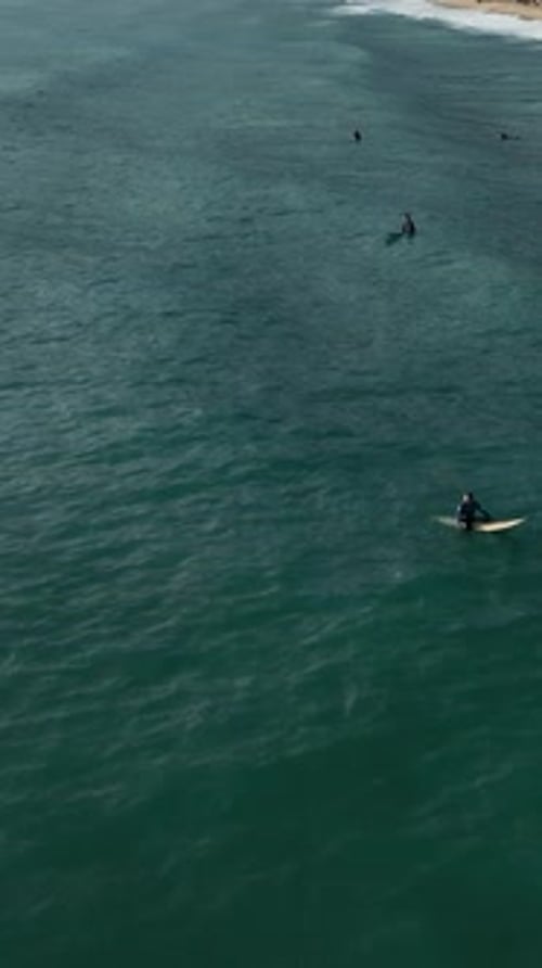 Vertical Video Cinematic Surfing Retreat Aerial View of Surfers in Alanya Turkey