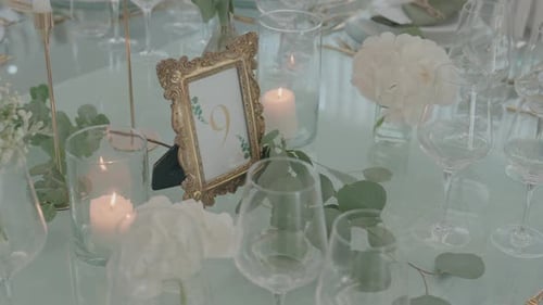 Elegant Table Setting with Candles and Floral Decor