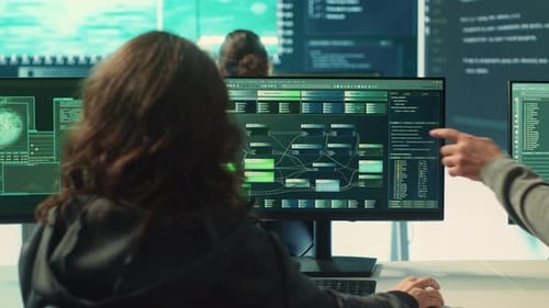 Cybersecurity Team Analyzing Data in Modern Office