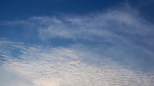 Blue Sky Filled with Fluffy White Clouds
