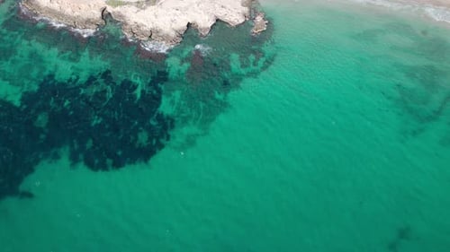 Aerial View Of Crystal Clear, Turquoise Water Of The Sea On A Sunny Day.