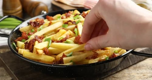 Loaded Fries with Bacon and Green Onions in Skillet