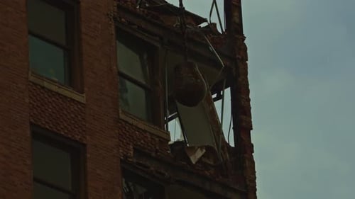 Wrecking Ball Impact on Brick Wall During Teardown
