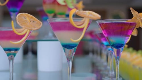 Colorful Cocktails with Orange Peel Garnishes