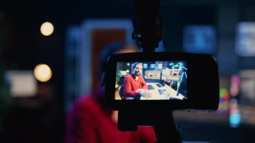 Focus on Photo Capturing Tools in Multimedia Agency Office Used By Photographer in Blurry Background