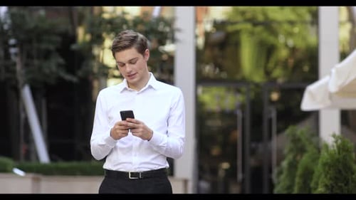 Portrait Successful Business Man Use Phone on the City Business District Street Mobile Caucasian