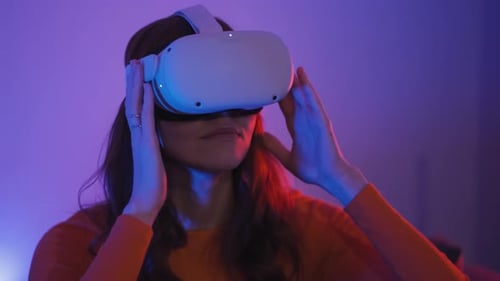 Woman Immersed in Virtual Reality Gaming in Home