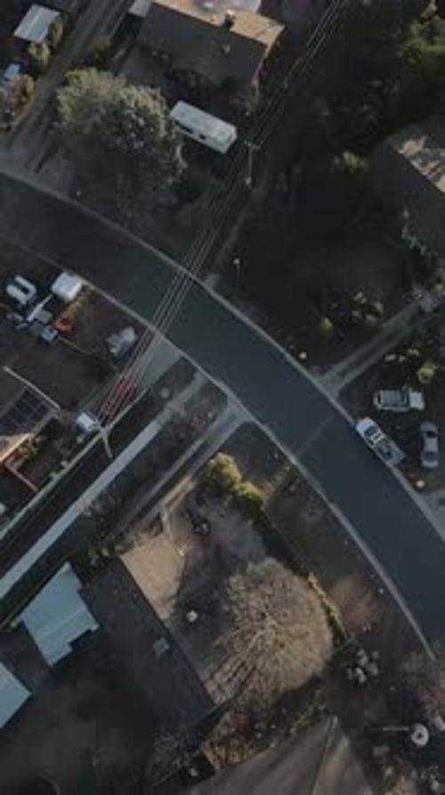 Vertical drone birds eye view flying over houses Canberra residential top down shot