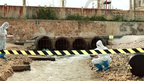 Scientists Analysing Water Near Industrial Area