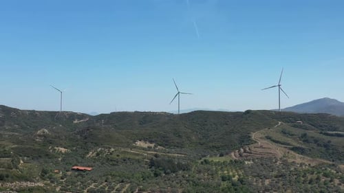 Renewable Energy Being Generated By Wind Turbines on Picturesque Hillside