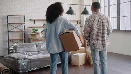 Happy African American Young Couple Feeling Euphoric While Moving Into Their New Own Apartment