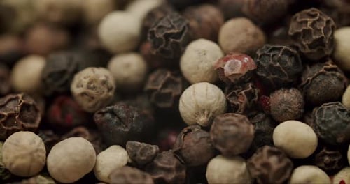 Macro Shot of Mixed Peppercorns Spice Background Texture
