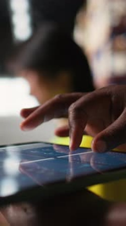Vertical Video Close Up of African American Person Checking Tracking Info for Parcels on Tablet
