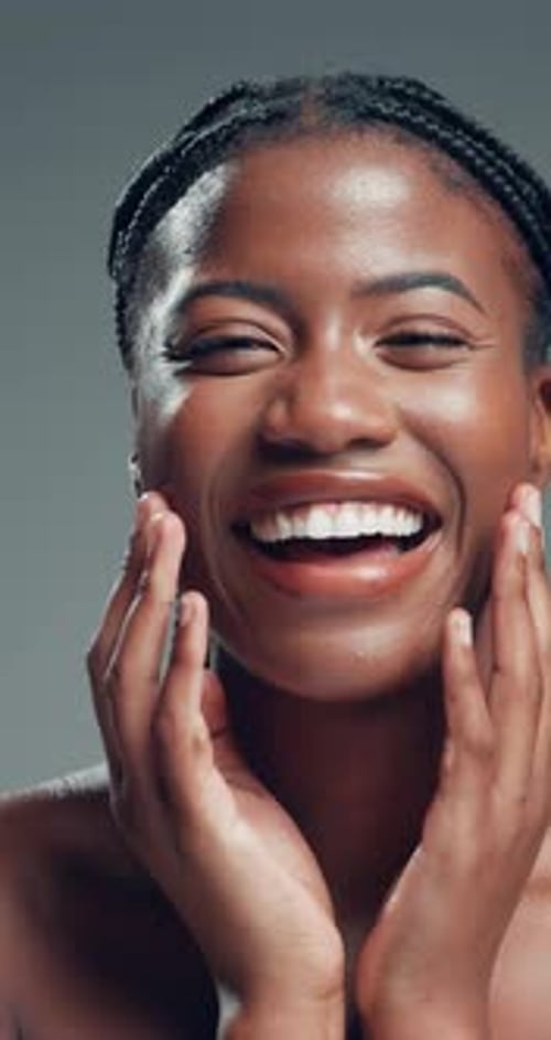 Beauty, face and laughing with African model in studio for cosmetics or dermatology satisfaction