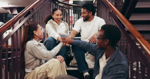 Happy people, students and stairs with hands together in library for teamwork, mission or support