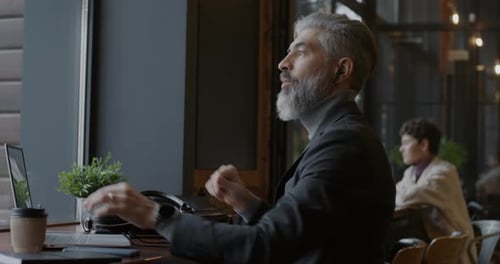 Business Man on Video Call at Cafe
