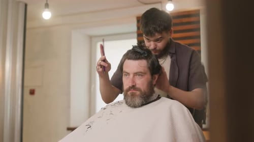 Man Gets Haircut in Modern Barbershop