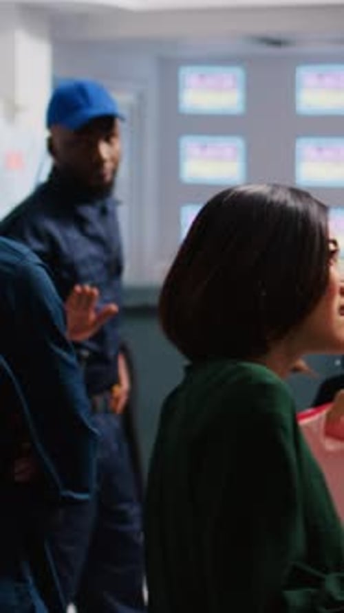 People Browse Clothing Racks in Fashion Boutique