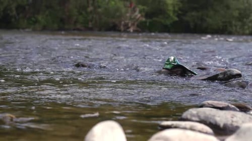 River pollution a stream choked with trash and industrial waste
