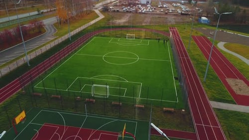 Large Football Field with Green Turf on Modern Sports Ground