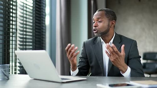 Professional Man In Office During Video Call