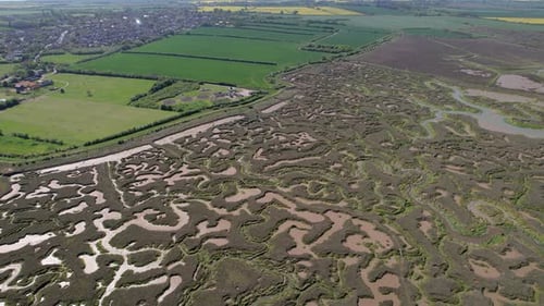 Aerial Panoramic View Of Salt Marshes At Tollesbury Marina, Essex, United Kingdom.