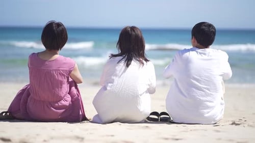 men and women looking at the sea