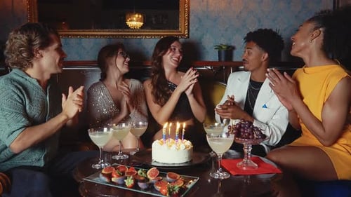 Happy friends celebrating in a cocktail bar