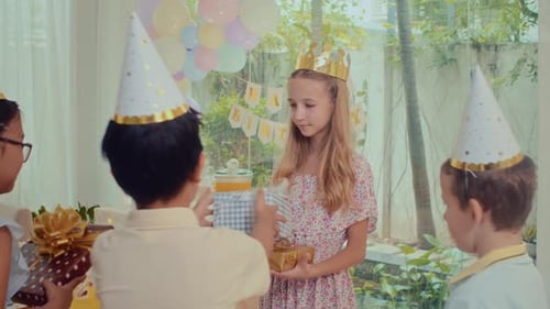 Kids Give Birthday Gifts at Celebration Party