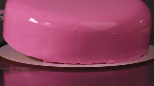 Glossy Pink Icing on a Round Cake