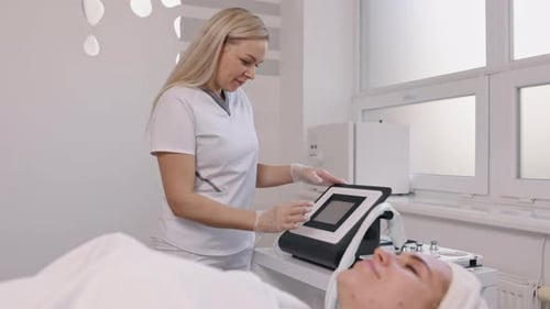 Medical Professional Using Touch Screen Device in Clinic