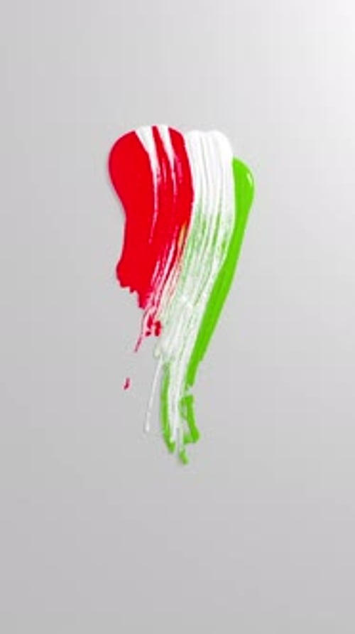 Glossy tricolor paint stroke on gray