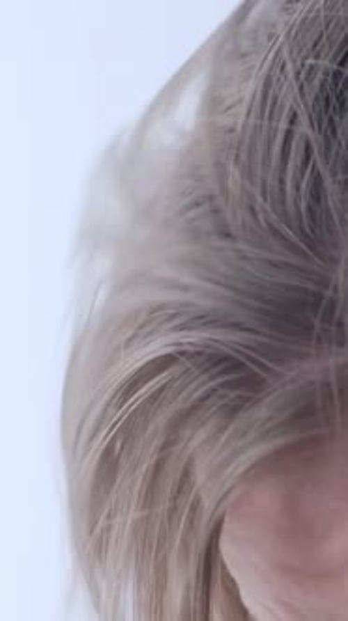 Early Gray Hair in a Young Woman Close Up Vertical Video