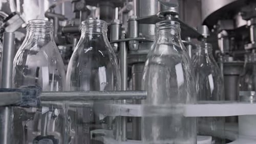 Automated Glass Bottle Filling Machine in Factory
