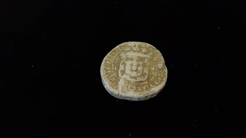 Close Up of a Round Discolored Coin