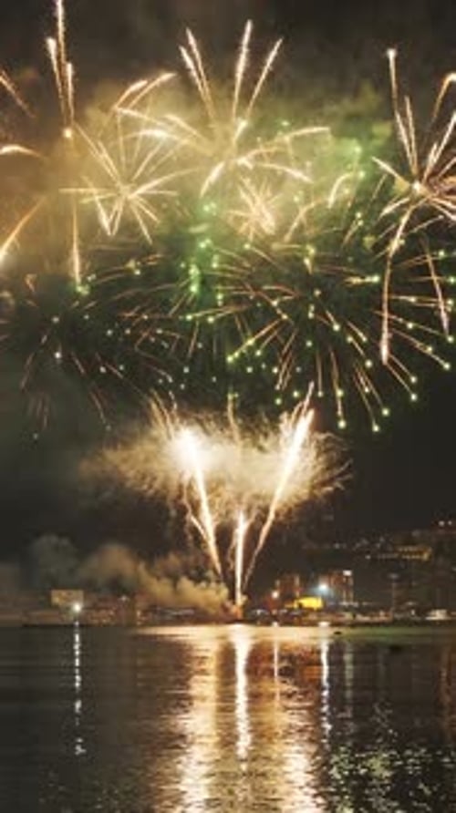 Fireworks with colorful lights over sea
