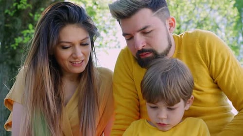 Happy Family Smiling in the Sun