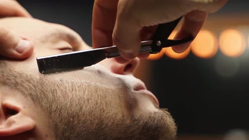 Bearded Man Gets Straight Razor Shave at Barbershop