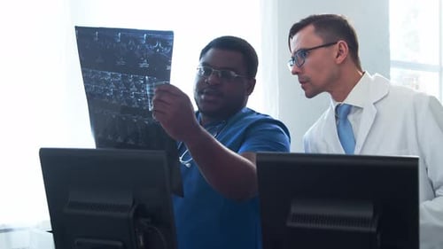 Doctor and Surgeon Talking Near Window Medical Workers in Hospital Office Day Light Healthcare
