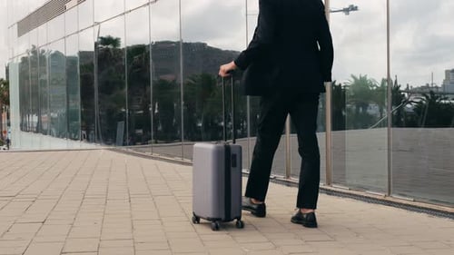 Tourist Man with Suitcase Baggage in Spain A Traveler with Luggage Suit Jacket on Business Street Go